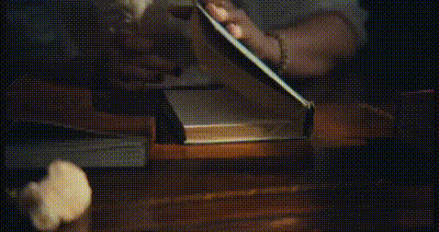close-up of a diary being opened and written in